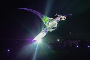 The hatchling dragon kite in flight.